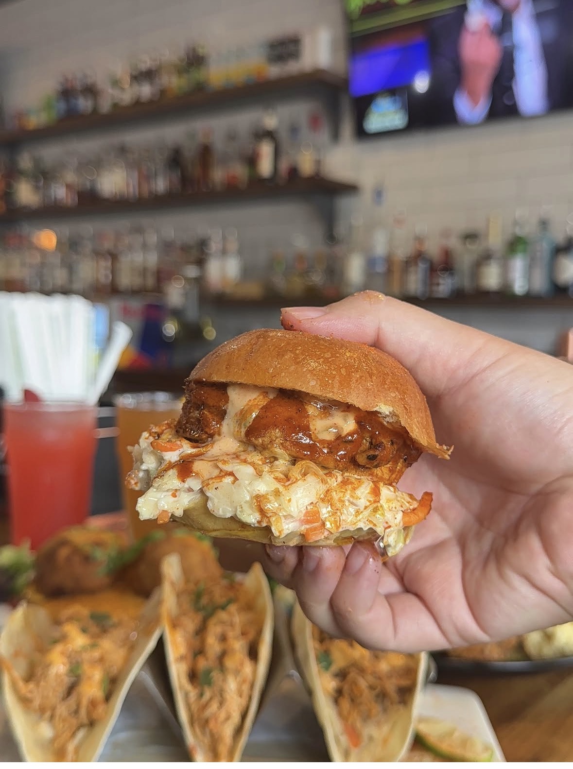 Founding Brothers hot chicken slider with tacos and drinks